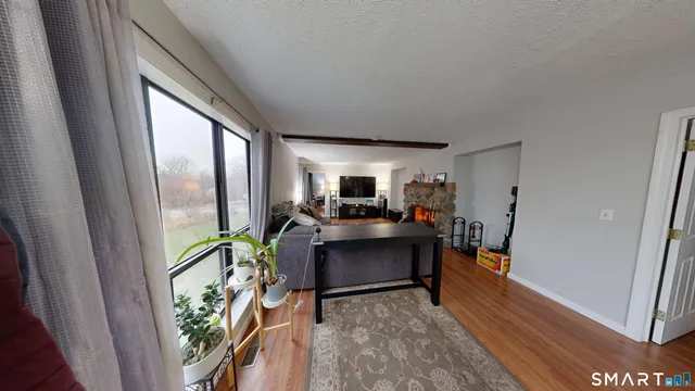 a view of living room with furniture and a flat screen tv