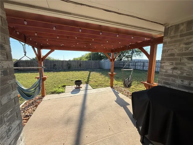 a view of a swimming pool with a patio