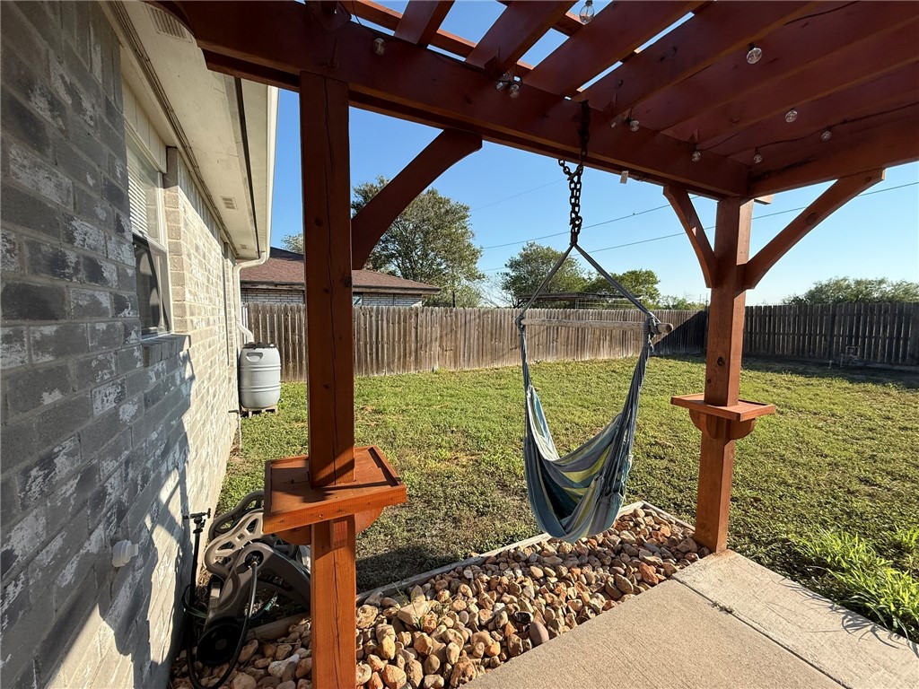 4148 Jamlie Road Kingsville, TX 78363 - Photo 16 of 18 a front view of a house with garden view and a potted plant