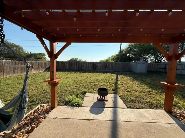 a backyard of a house with lots of green space
