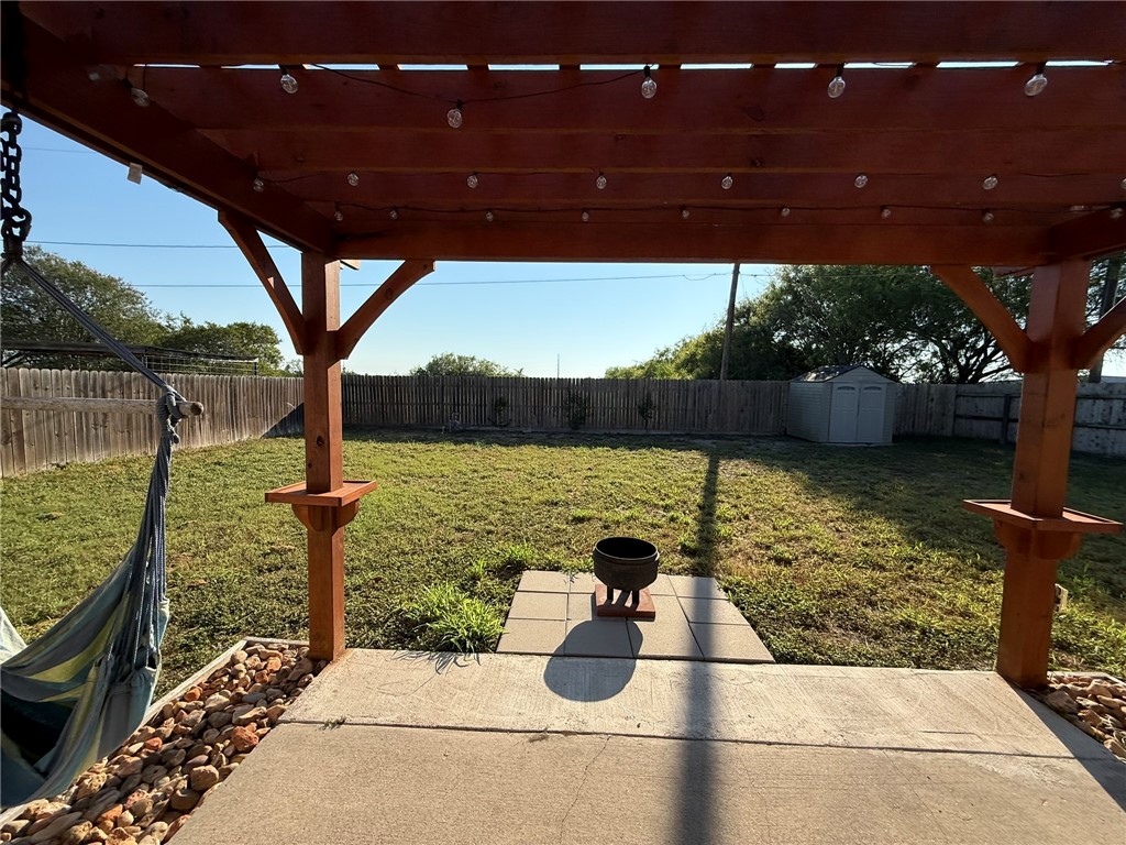 4148 Jamlie Road Kingsville, TX 78363 - Photo 17 of 18 a backyard of a house with lots of green space