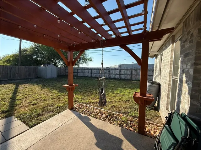 a view of a swimming pool with a patio