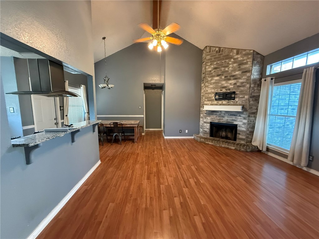 4148 Jamlie Road Kingsville, TX 78363 - Photo 10 of 18 a view of a living room hardwood floor and a ceiling fan