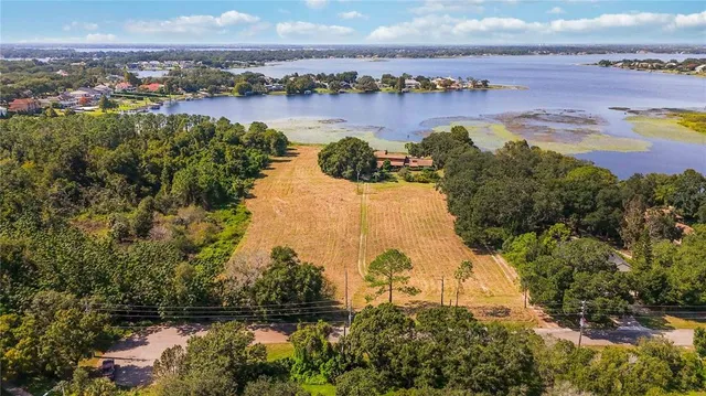 an aerial view of a city and lake view