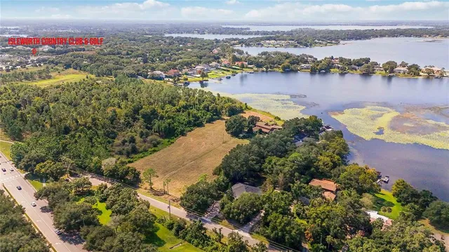 an aerial view of a house with a lake view