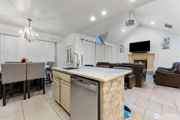 a kitchen that has a lot of cabinets in it