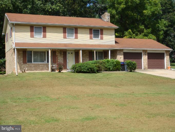 2408 Rochelle Drive Fallston, MD 21047 - Photo 2 of 6 a front view of a house with a garden