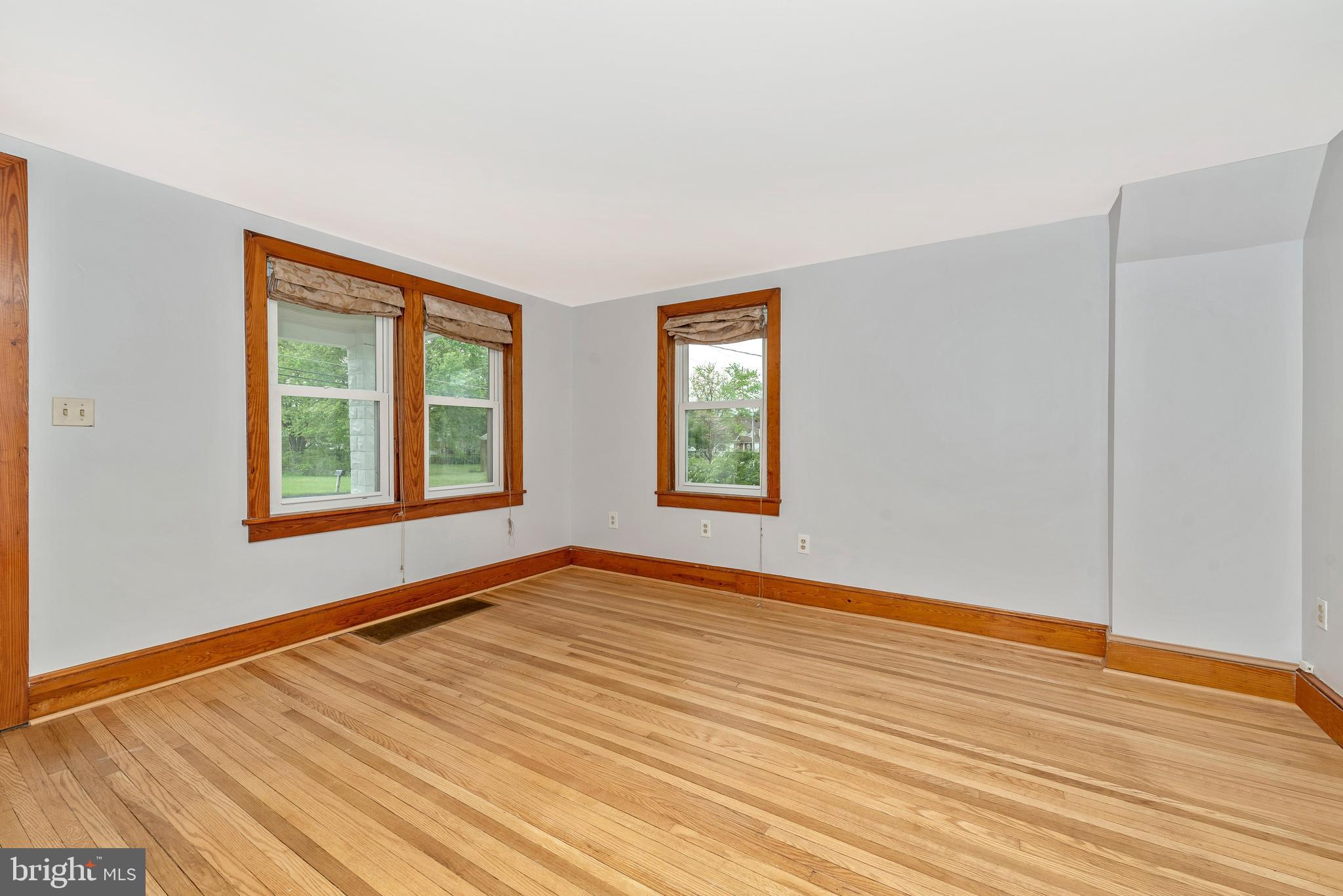 7832 Rocky Springs Road Frederick, MD 21702 - Photo 6 of 41 Living room - wood floors and wood casings.