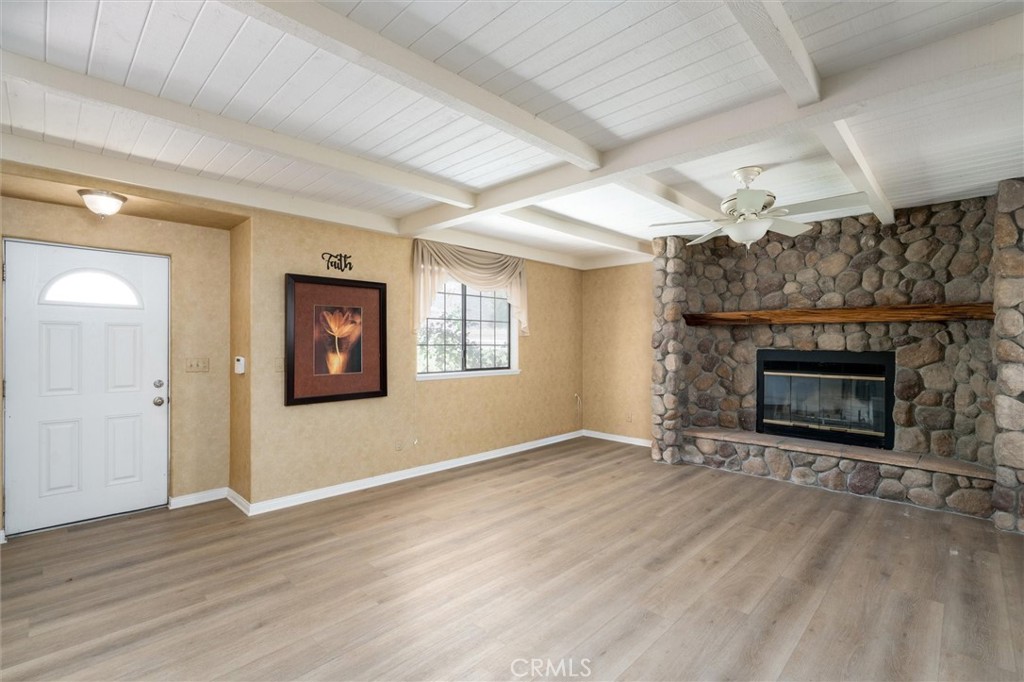 34150 Stowe Road Winchester, CA 92545 - Photo 13 of 80 an empty room with windows and fireplace