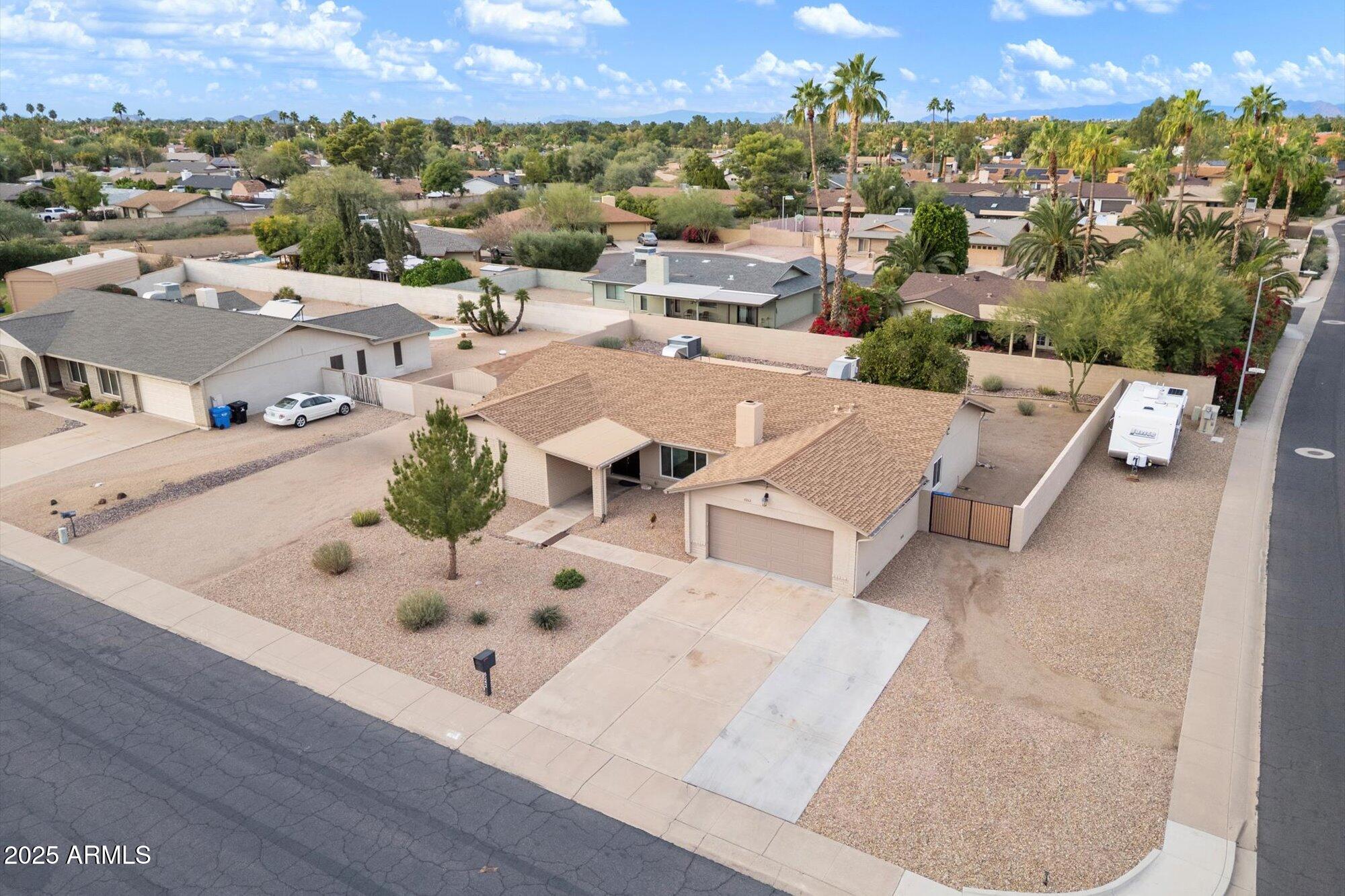 an aerial view of a house with outdoor space