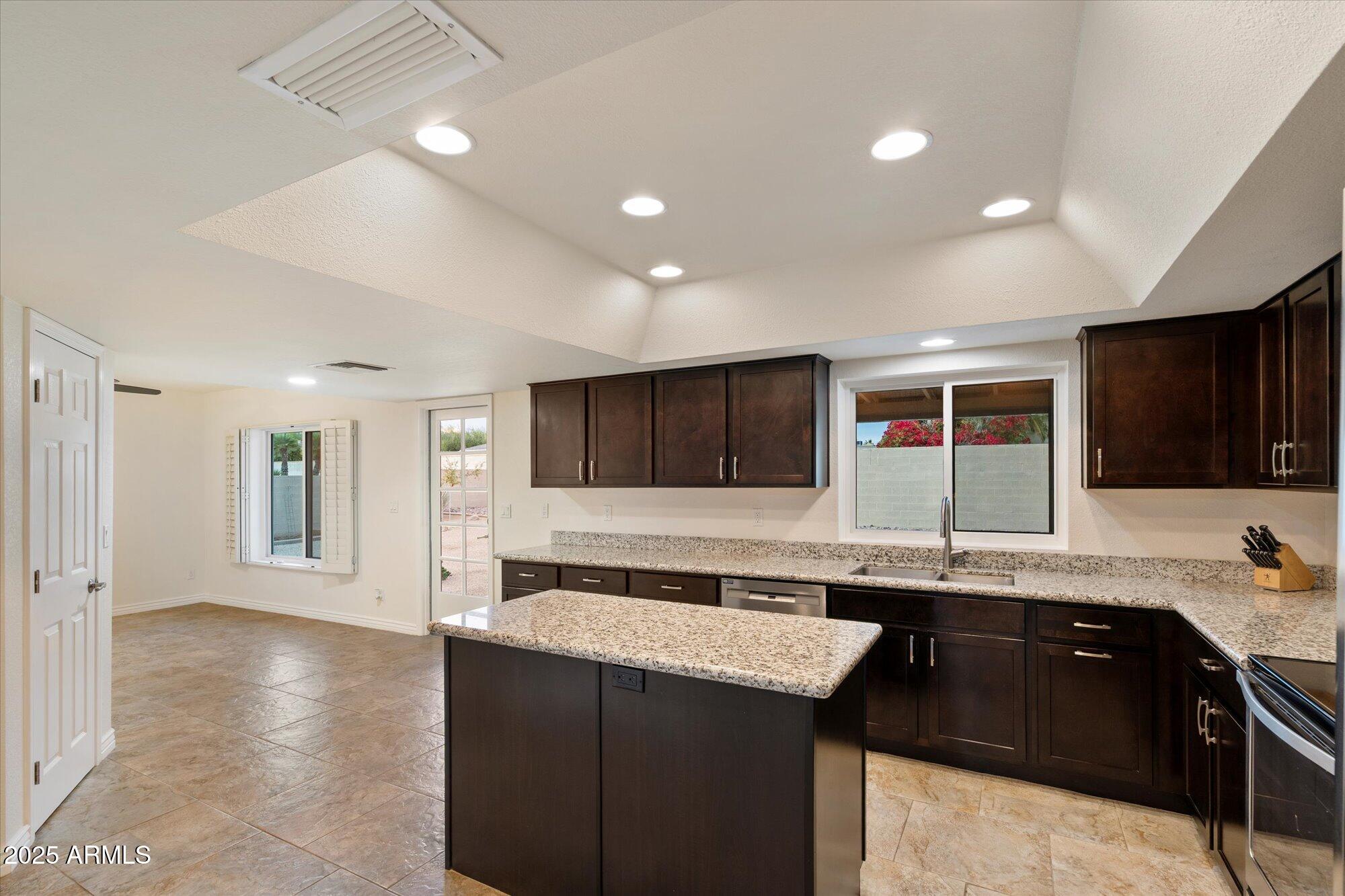 6242 East Hearn Road Scottsdale, AZ 85254 - Photo 10 of 40 a kitchen with a sink and cabinets