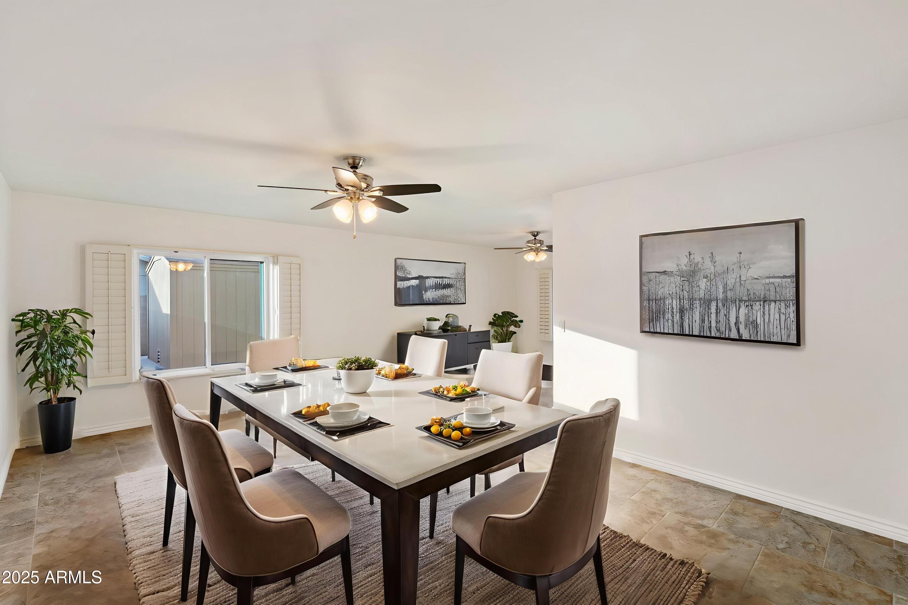 6242 East Hearn Road Scottsdale, AZ 85254 - Photo 14 of 40 a dining room with furniture and window