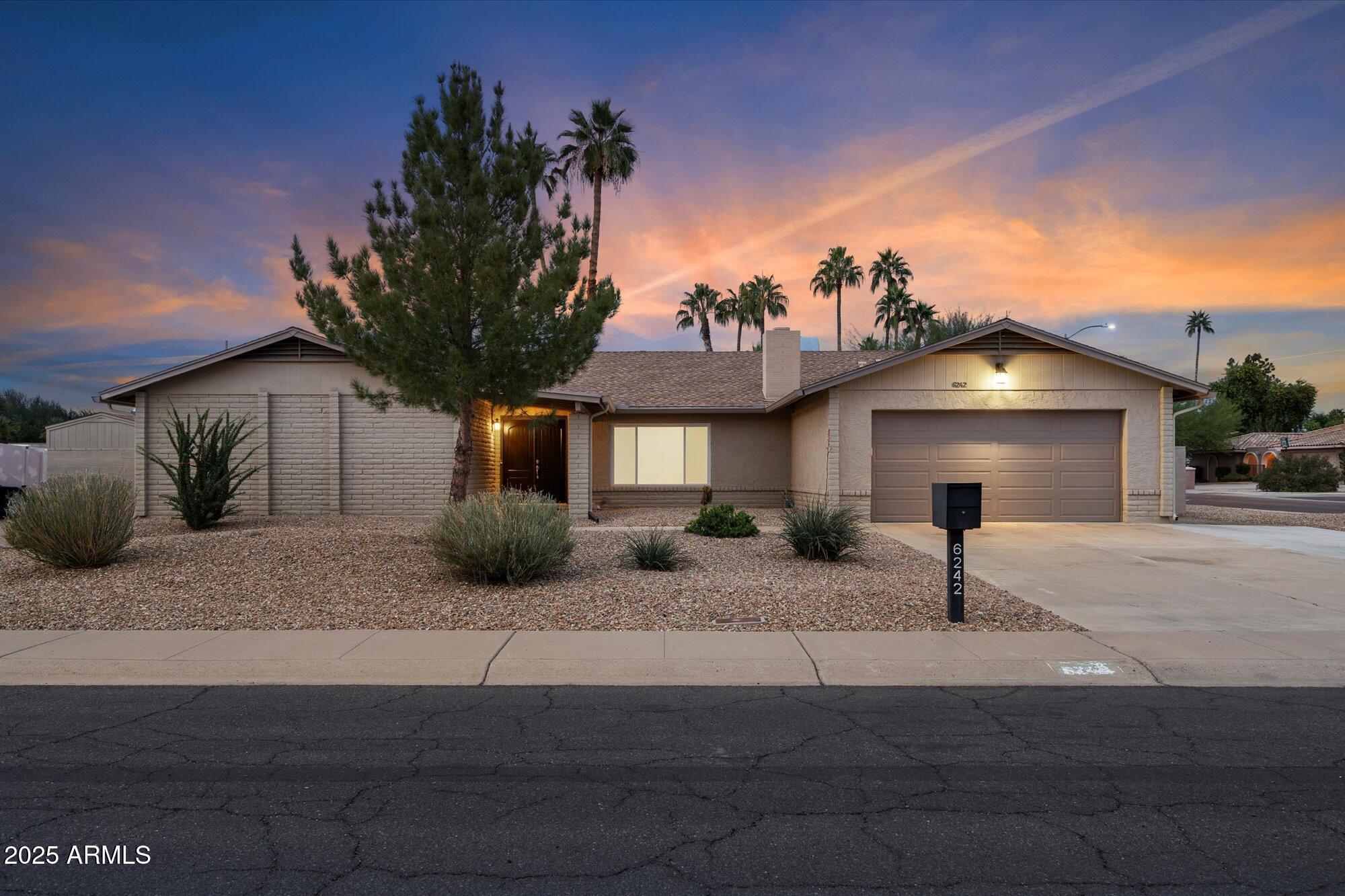 6242 East Hearn Road Scottsdale, AZ 85254 - Photo 2 of 40 a view of a house with a patio
