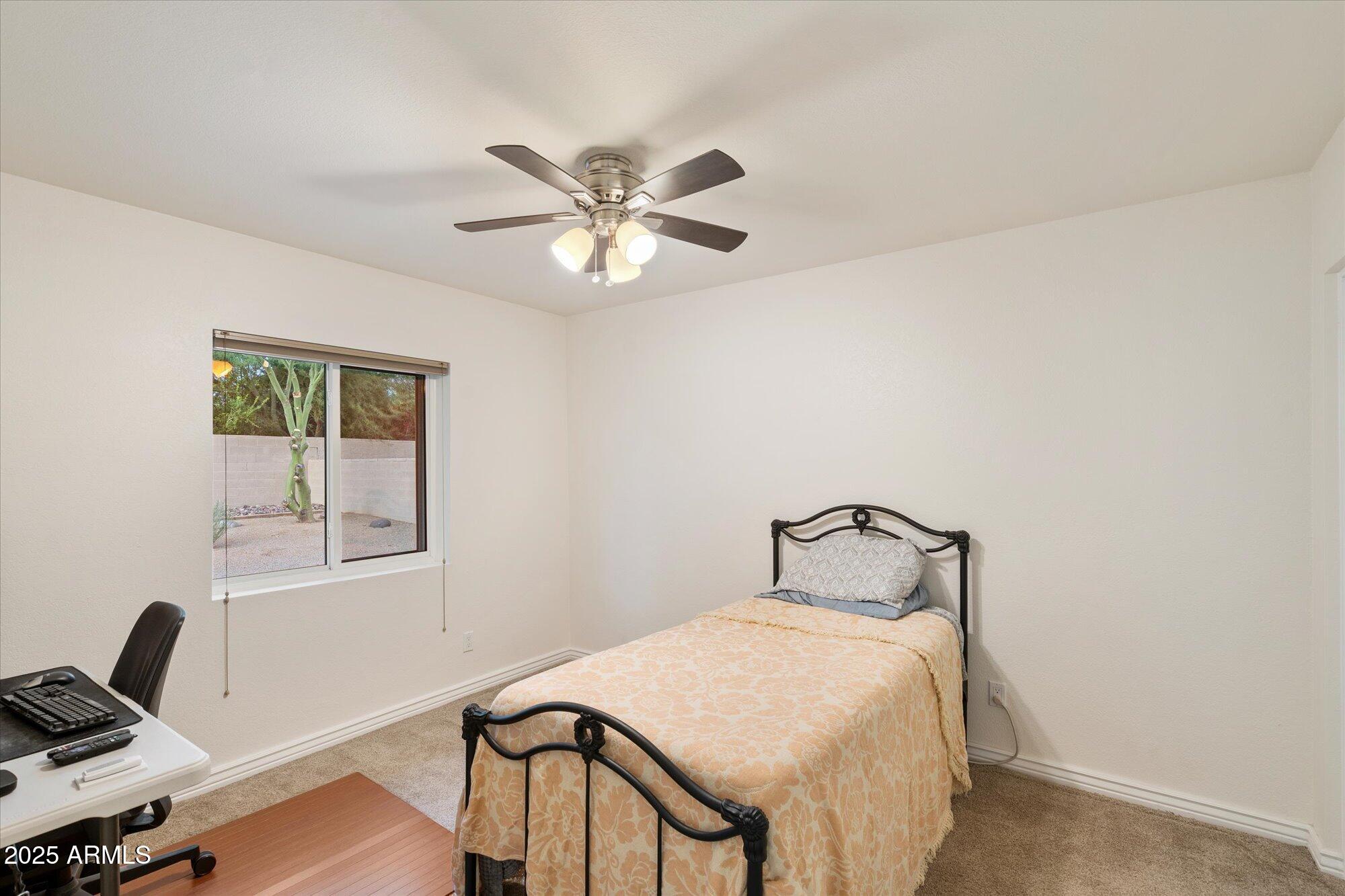 6242 East Hearn Road Scottsdale, AZ 85254 - Photo 23 of 40 a bedroom with a bed and a window