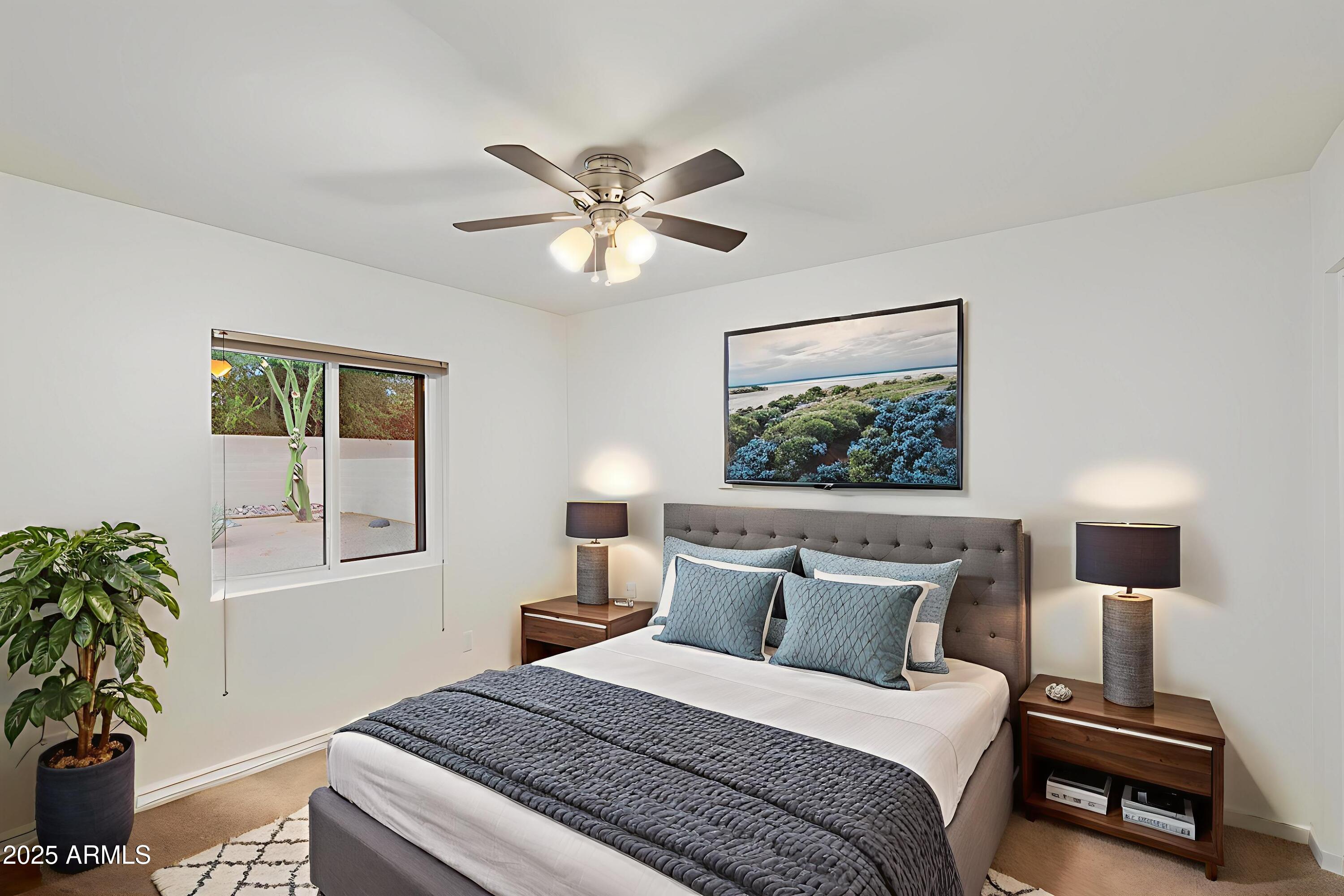 6242 East Hearn Road Scottsdale, AZ 85254 - Photo 24 of 40 a bedroom with a large bed and a window