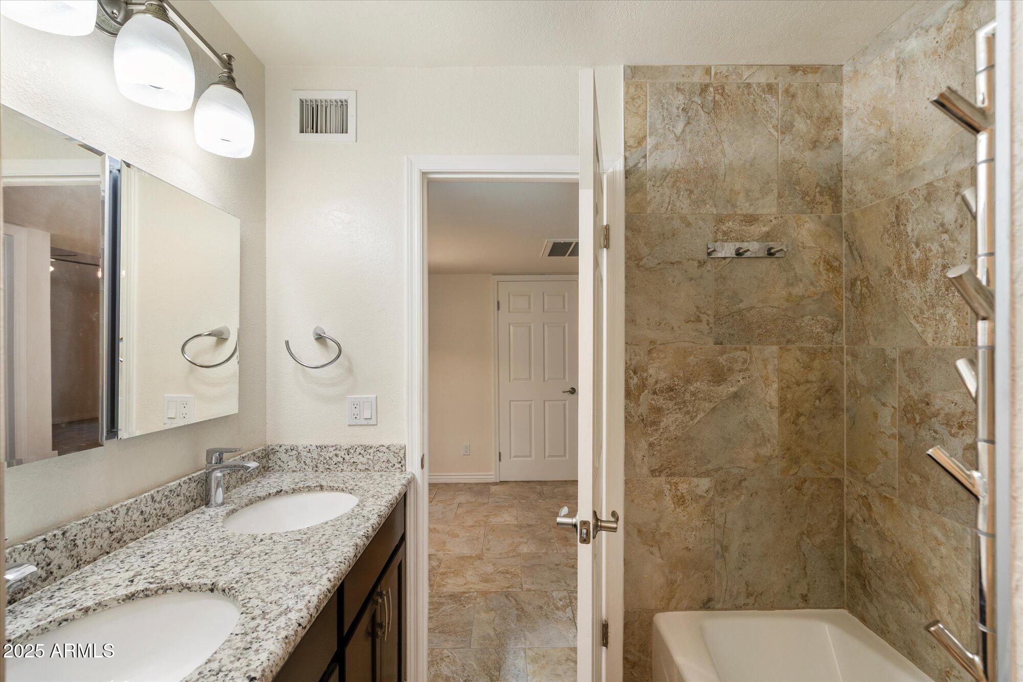 6242 East Hearn Road Scottsdale, AZ 85254 - Photo 25 of 40 a bathroom with a granite countertop shower sink vanity and mirror