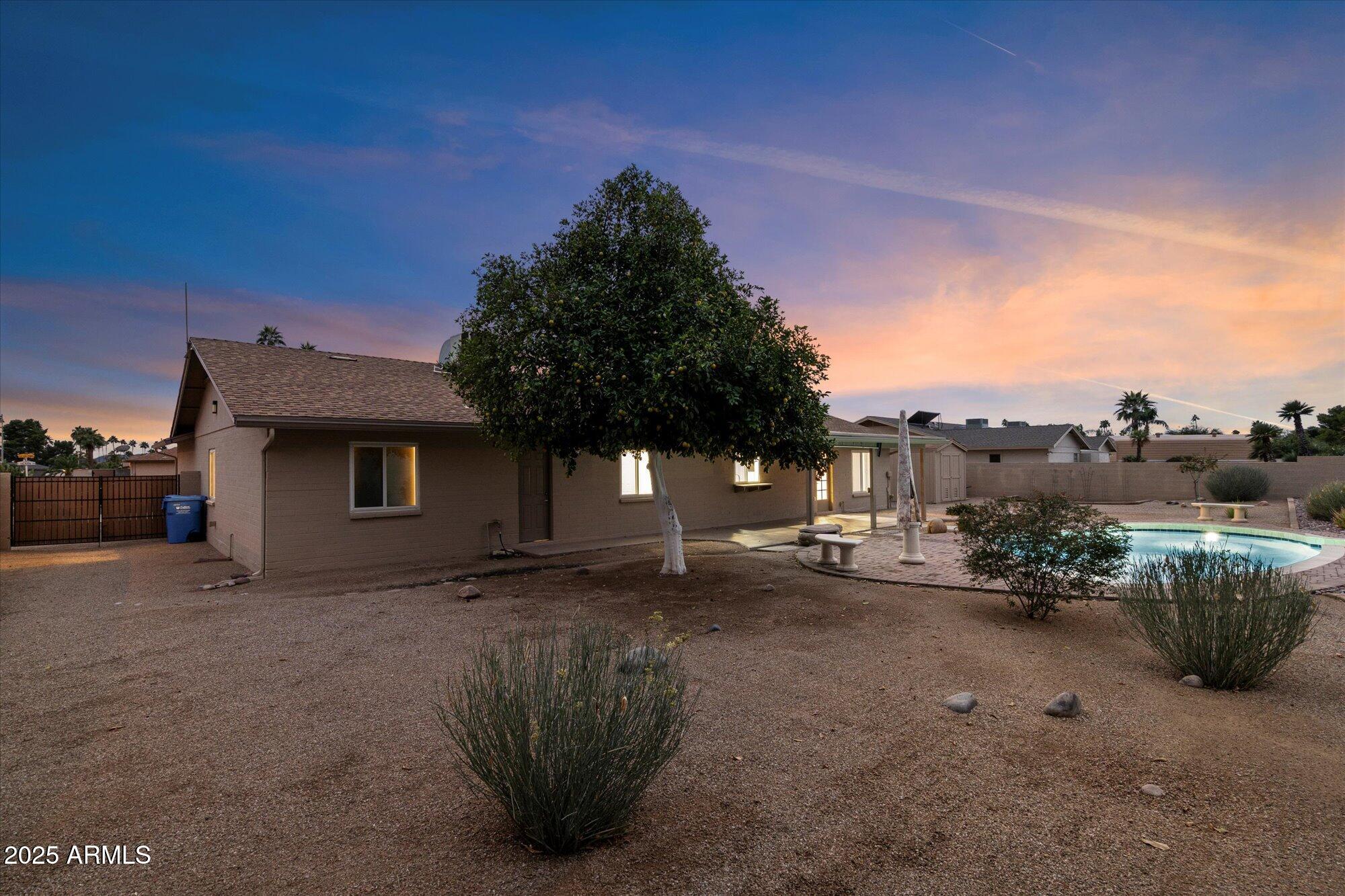 6242 East Hearn Road Scottsdale, AZ 85254 - Photo 29 of 40 a view of a house with a garden