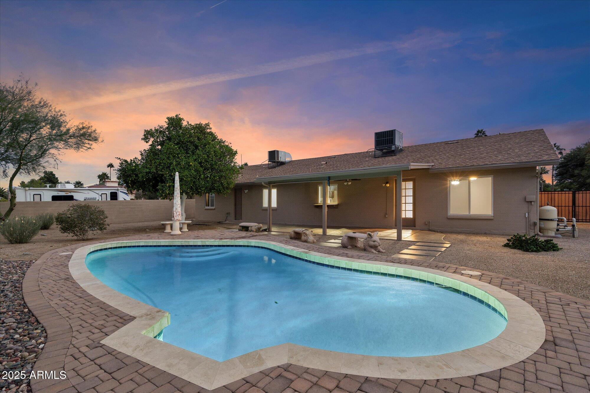6242 East Hearn Road Scottsdale, AZ 85254 - Photo 3 of 40 a view of a house with swimming pool and porch with furniture