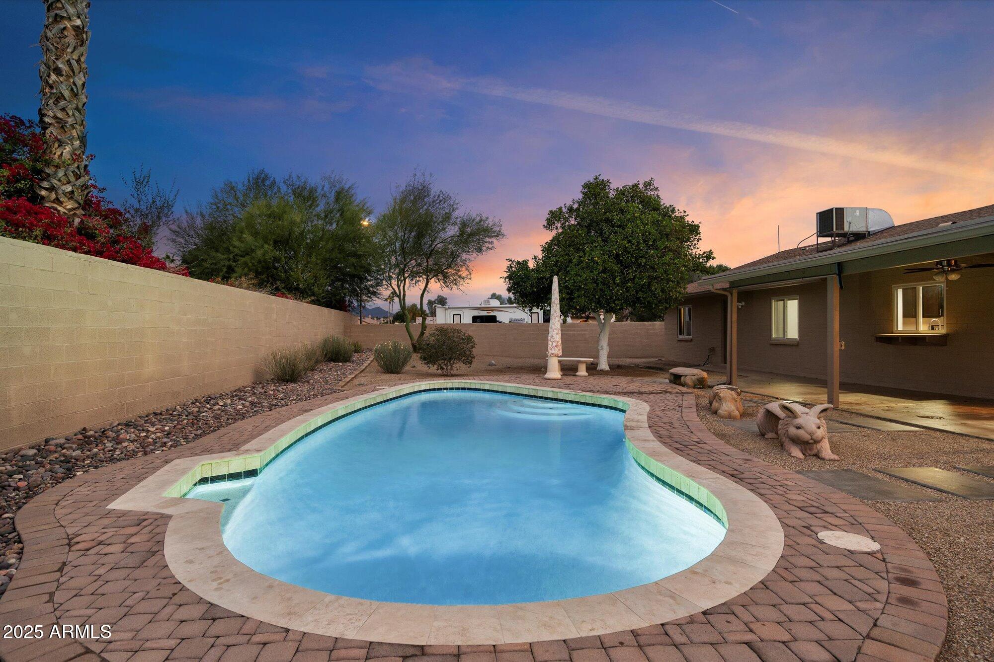 6242 East Hearn Road Scottsdale, AZ 85254 - Photo 31 of 40 a view of a swimming pool with a yard