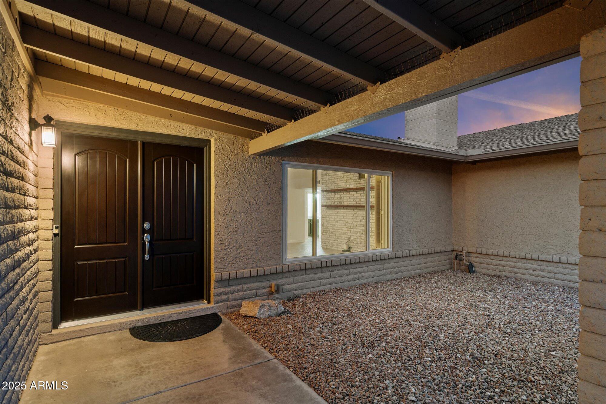 6242 East Hearn Road Scottsdale, AZ 85254 - Photo 4 of 40 a view of an entrance of the house