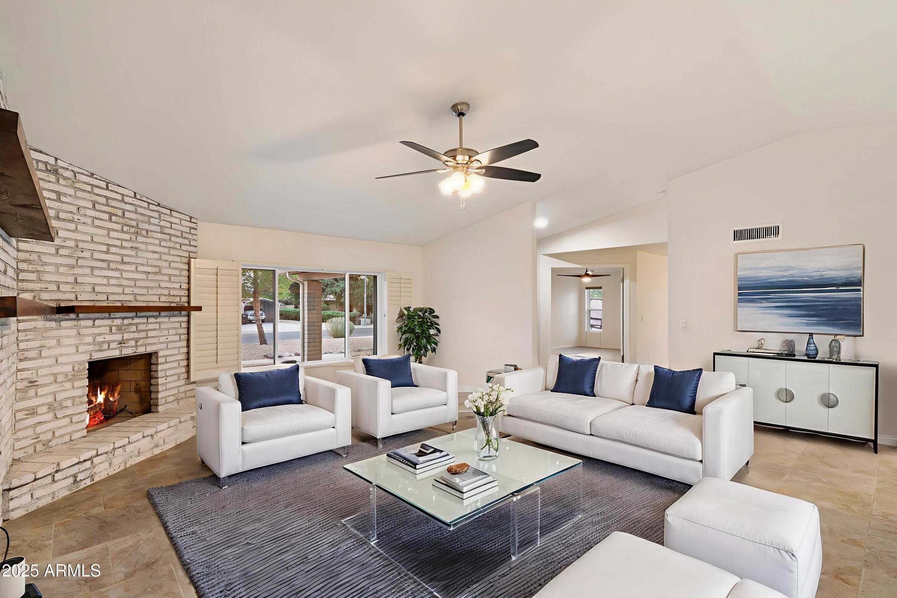 6242 East Hearn Road Scottsdale, AZ 85254 - Photo 8 of 40 a living room with furniture and a fireplace