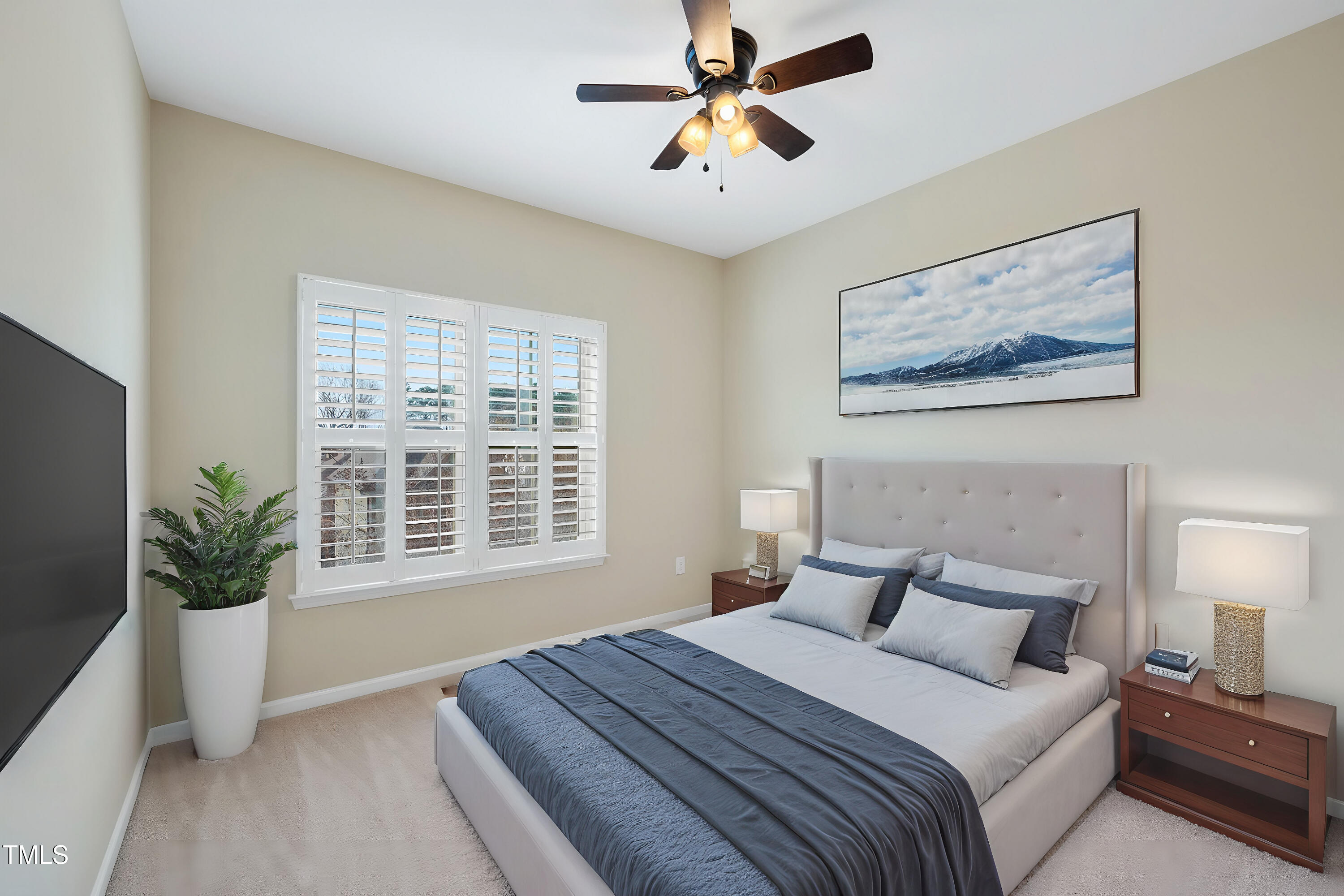 1319 Rodessa Run Raleigh, NC 27607 - Photo 23 of 34 a bedroom with a large bed and a potted plant
