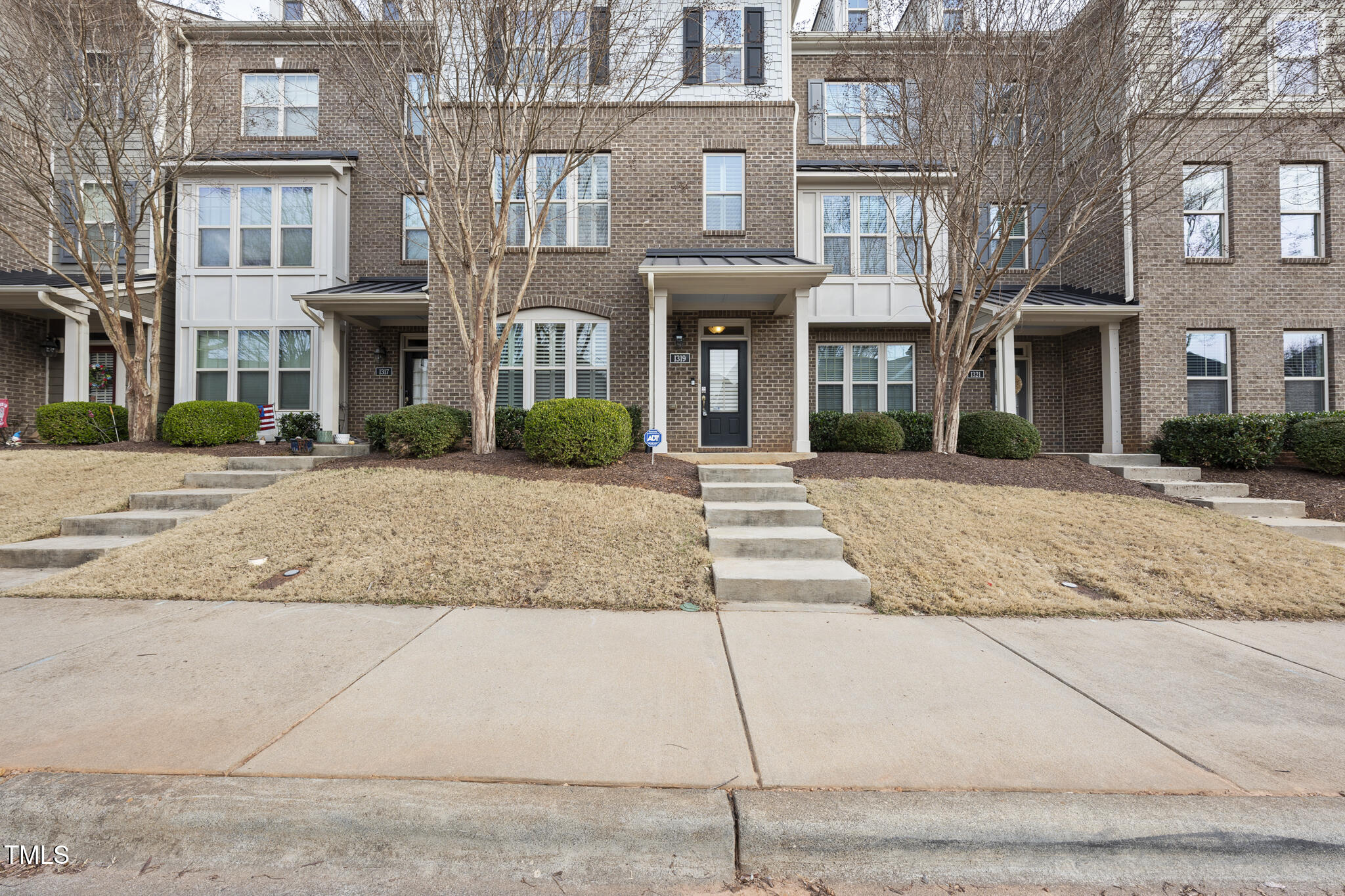 1319 Rodessa Run Raleigh, NC 27607 - Photo 32 of 34 a front view of a brick building