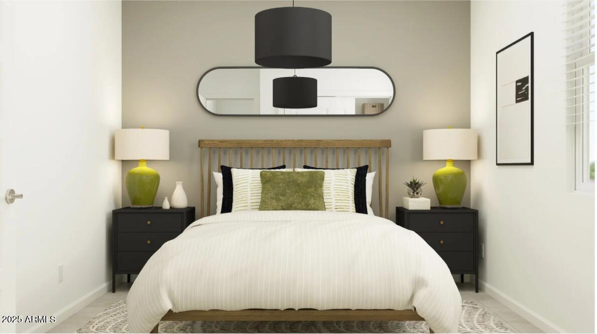 14955 West Hackamore Drive Surprise, AZ 85387 - Photo 10 of 19 a bedroom with a bed and a lamp