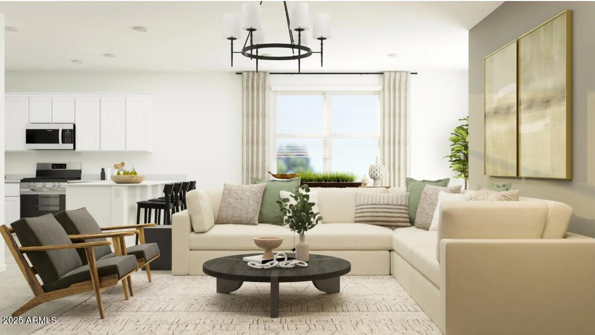 14955 West Hackamore Drive Surprise, AZ 85387 - Photo 5 of 19 a living room with furniture and a large window