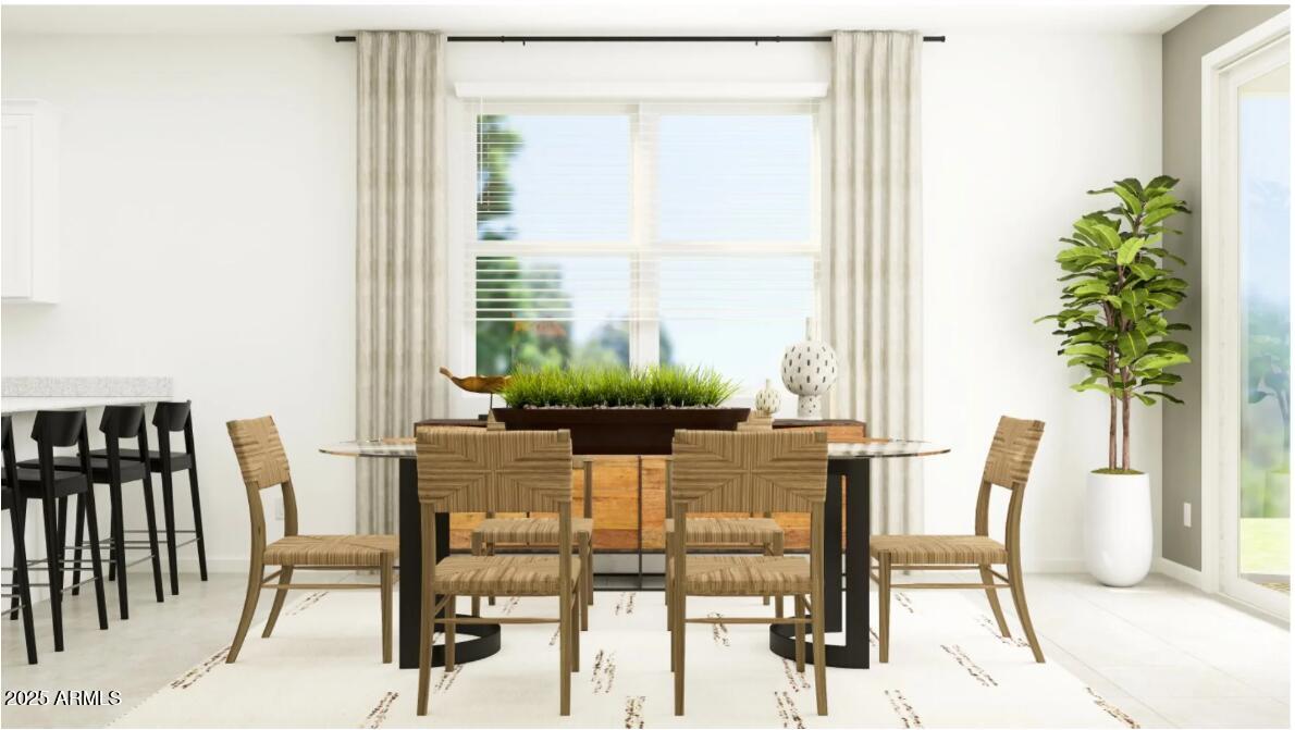 14955 West Hackamore Drive Surprise, AZ 85387 - Photo 7 of 19 a view of a dining room with furniture and a potted plant