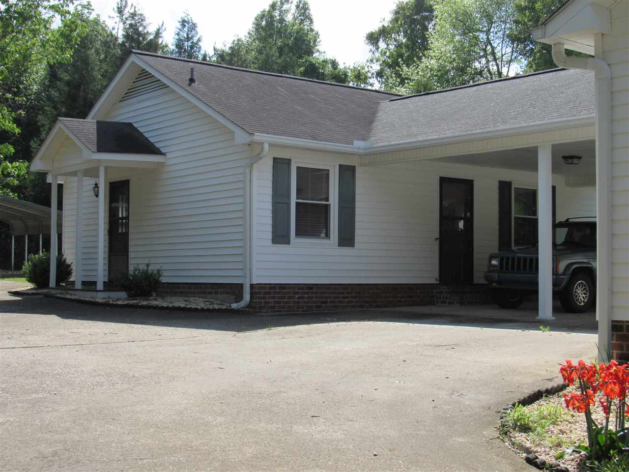 373 Skinner Road Four Oaks, NC 27524 - Photo 13 of 25 Detached apartment behind home joined with carport. Two bedrooms, full bath, living room, kitchen/dining. Detached Apartment
