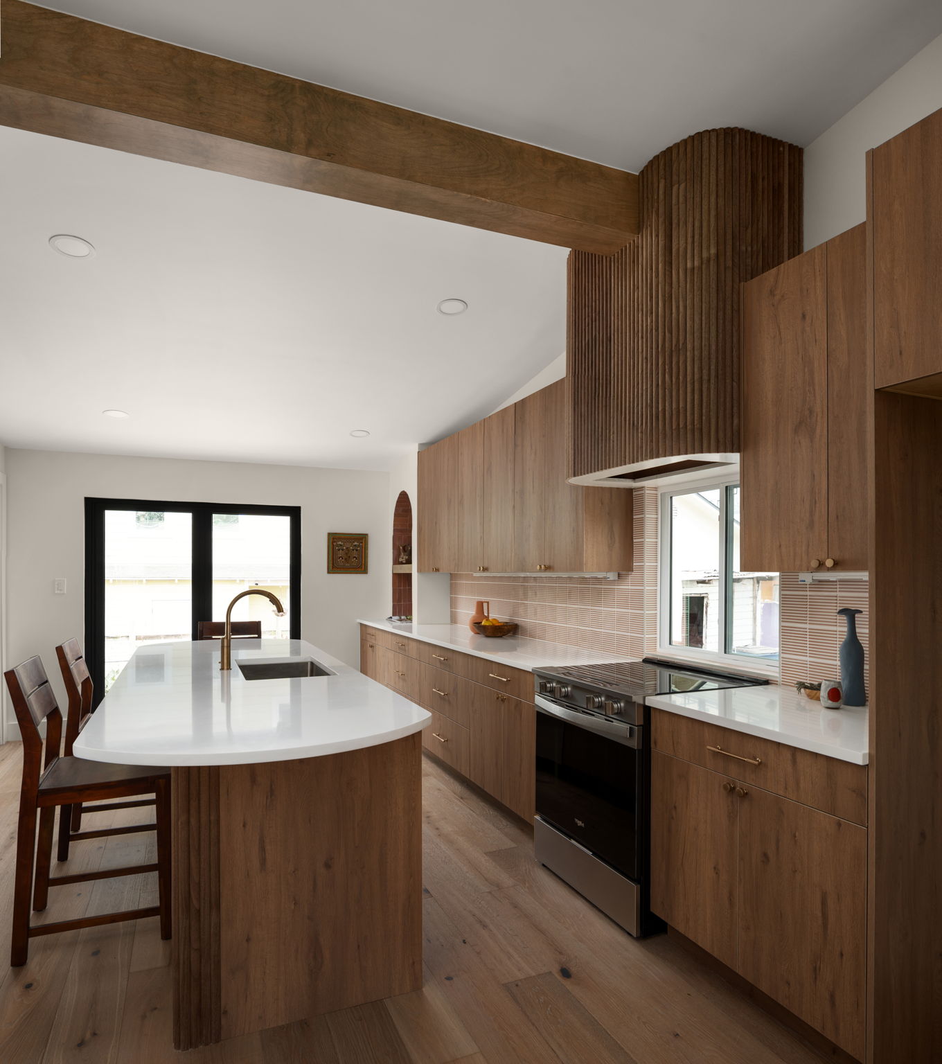 a kitchen with a sink cabinets and window