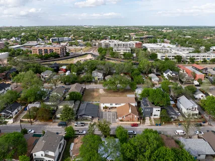 an aerial view of residential houses with outdoor space