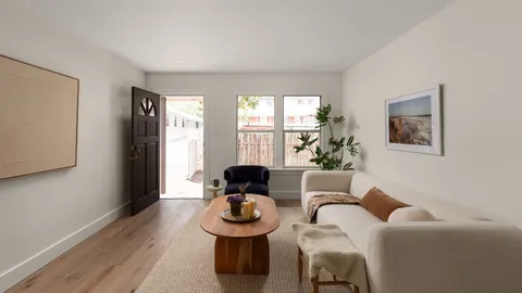 a living room with furniture and window