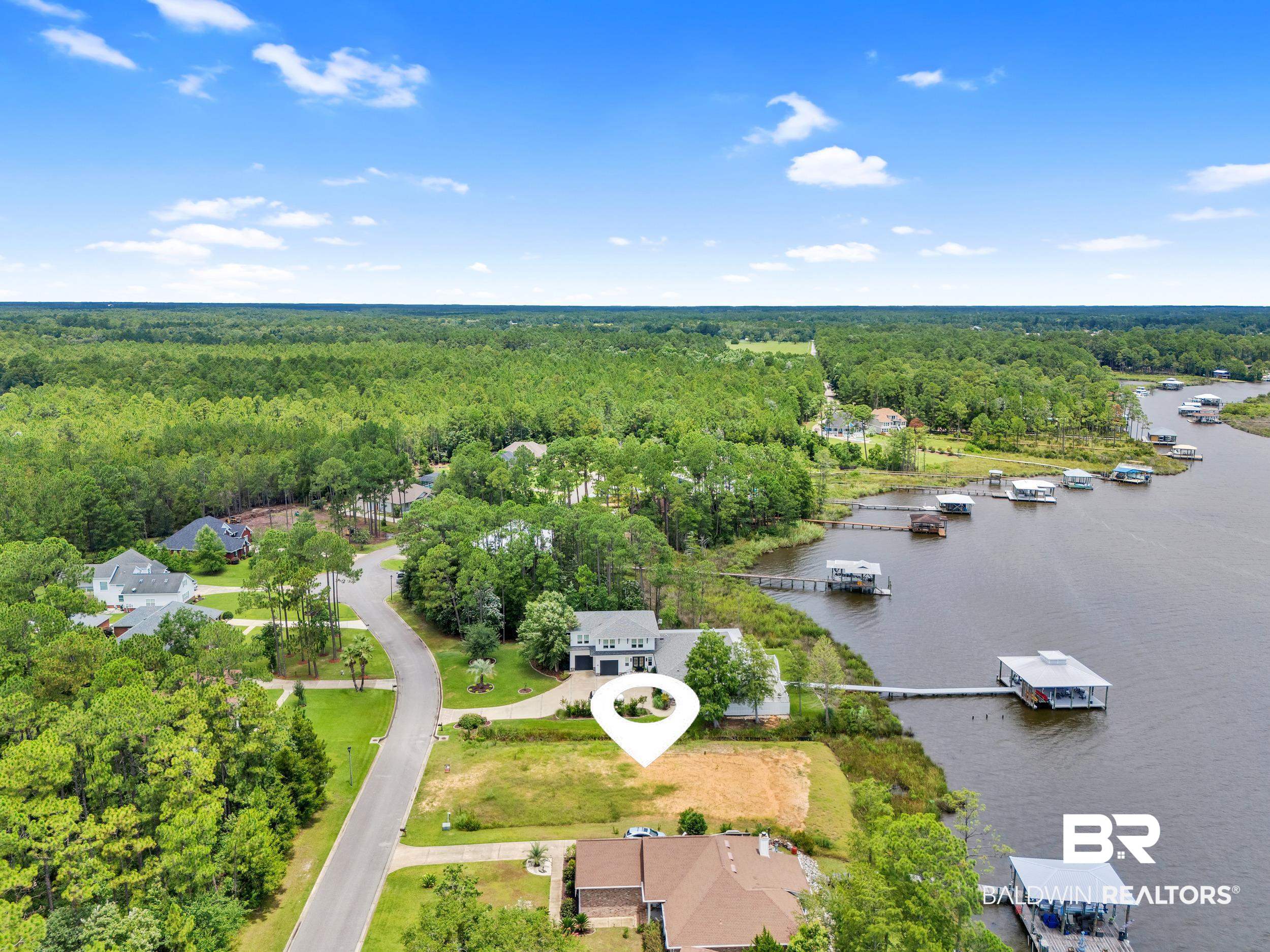 8963 Bay Point Drive Elberta, AL 36530 - Photo 15 of 25 Bird's eye view of a heavily wooded area and a large body of water