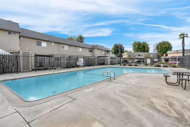 a view of swimming pool with outdoor seating