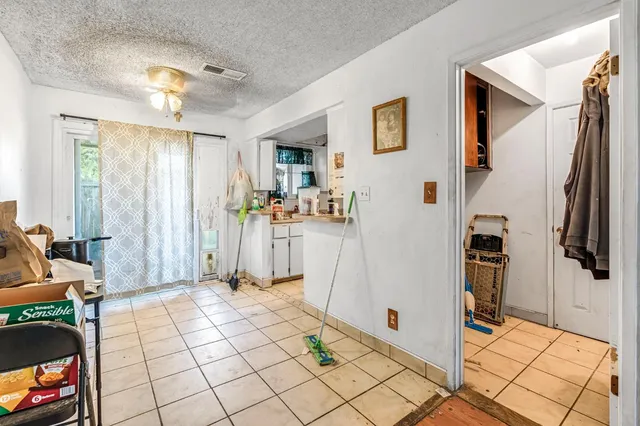 a view of a livingroom with walk in closet and bedroom