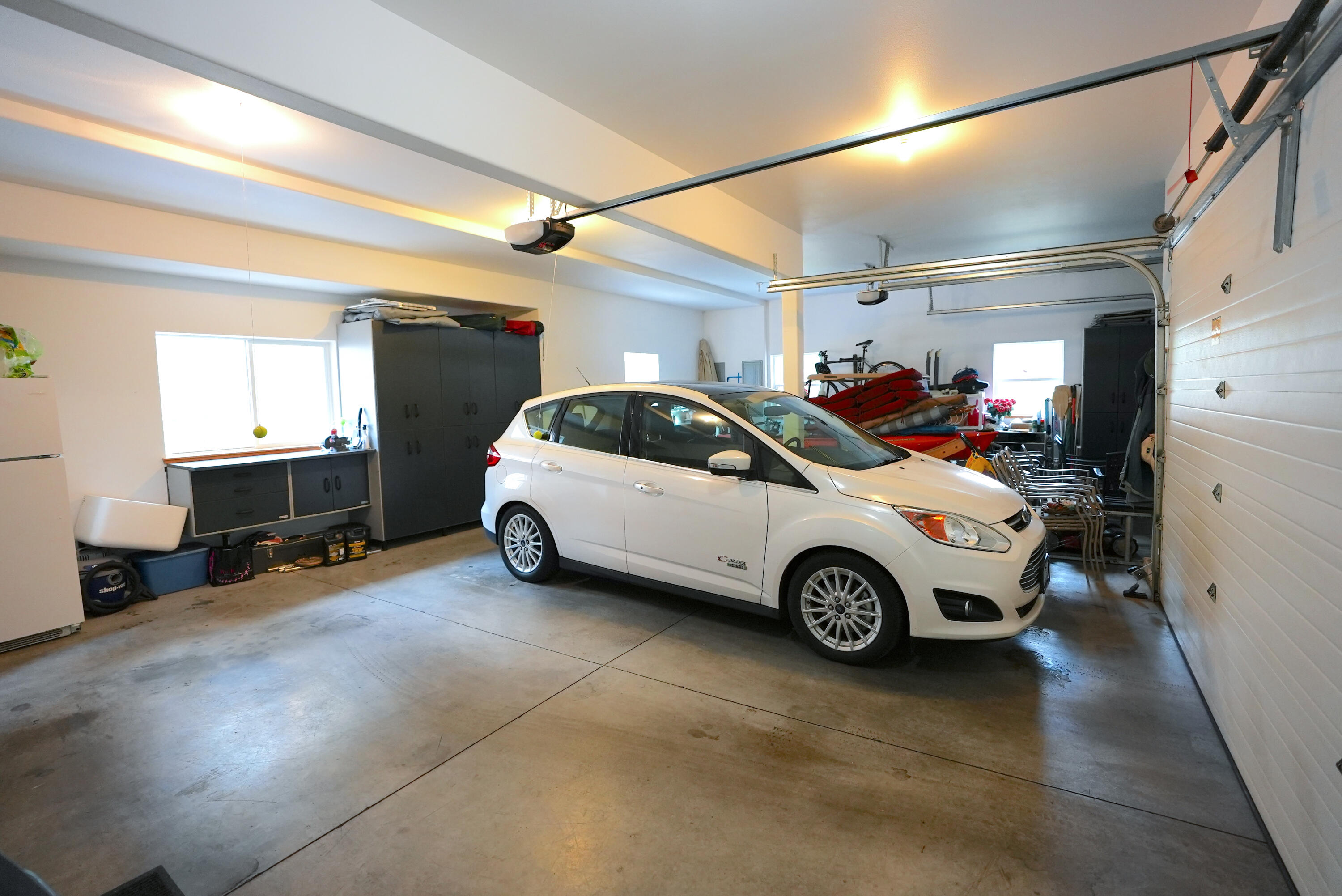 60709 Golf Village Loop Bend, OR 97702 - Photo 43 of 45 Three car garage - storage units behind vehicle