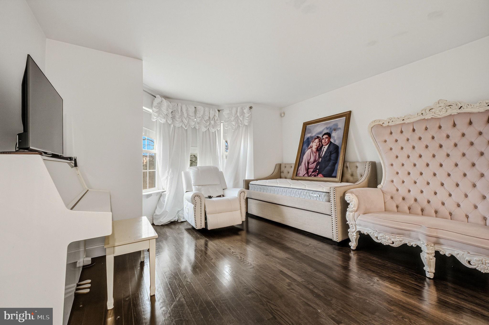 346 Bear Christiana Road Bear, DE 19701 - Photo 8 of 35 a living room with furniture and a flat screen tv
