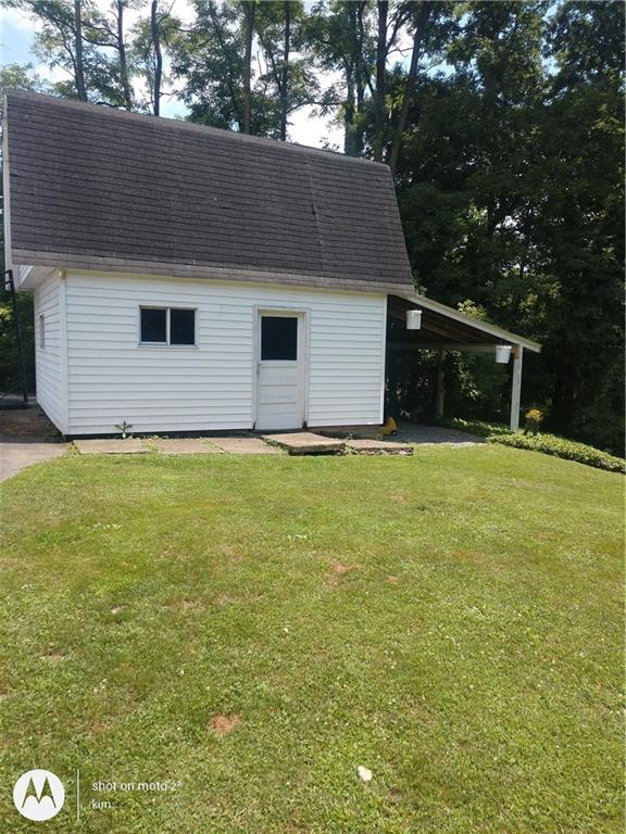 1820 Scrubgrass Road Mercer, PA 16137 - Photo 3 of 18 a front view of house with yard and trees all around