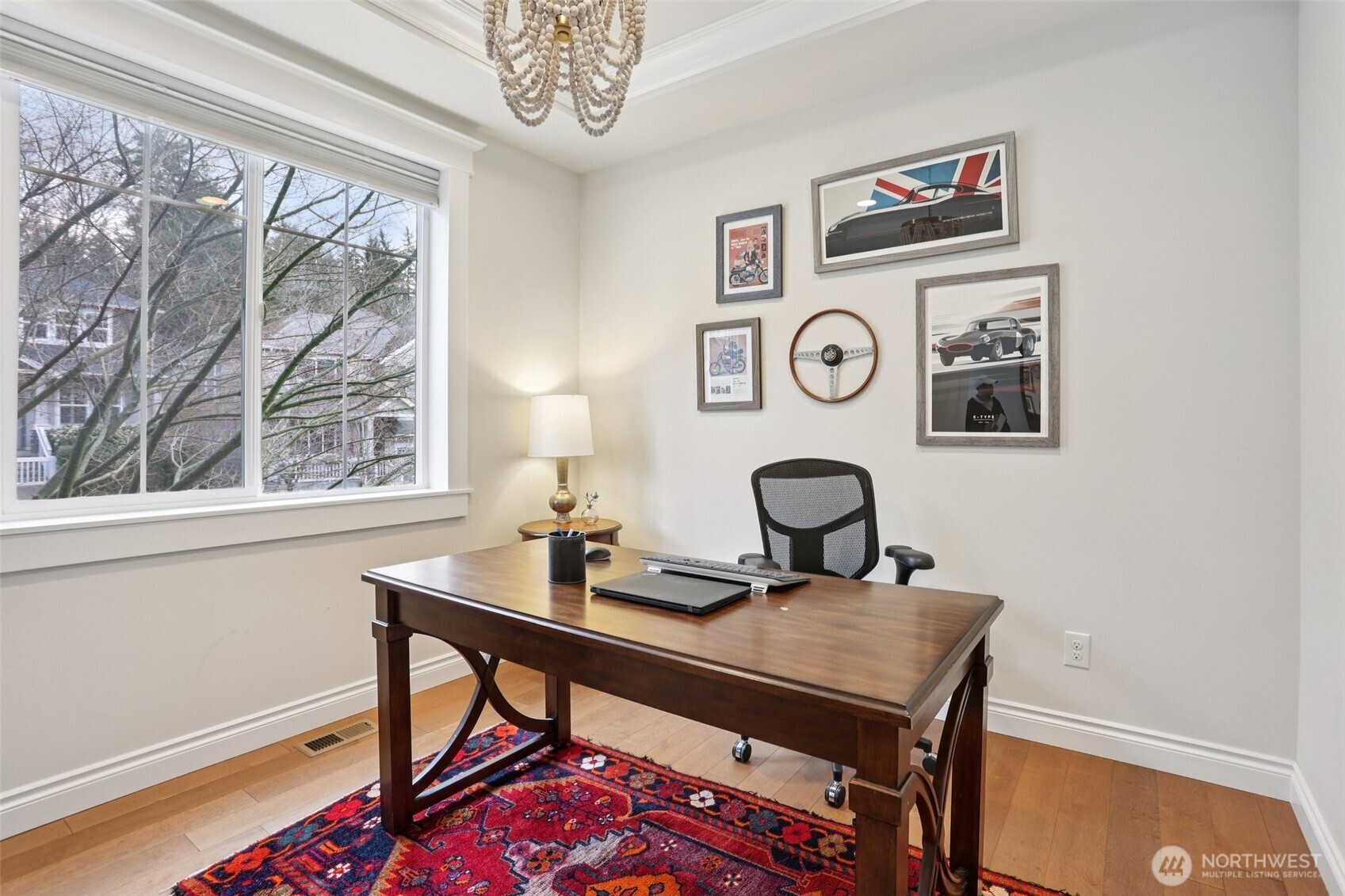 14025 163rd Place Southeast Renton, WA 98059 - Photo 11 of 33 a view of a workspace with a table and a potted plant