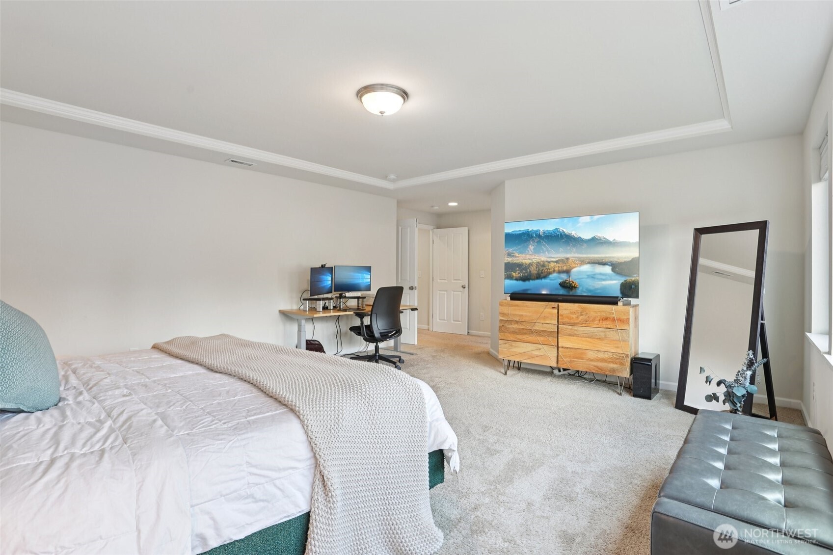 14025 163rd Place Southeast Renton, WA 98059 - Photo 13 of 33 a bed room with a bed and a television