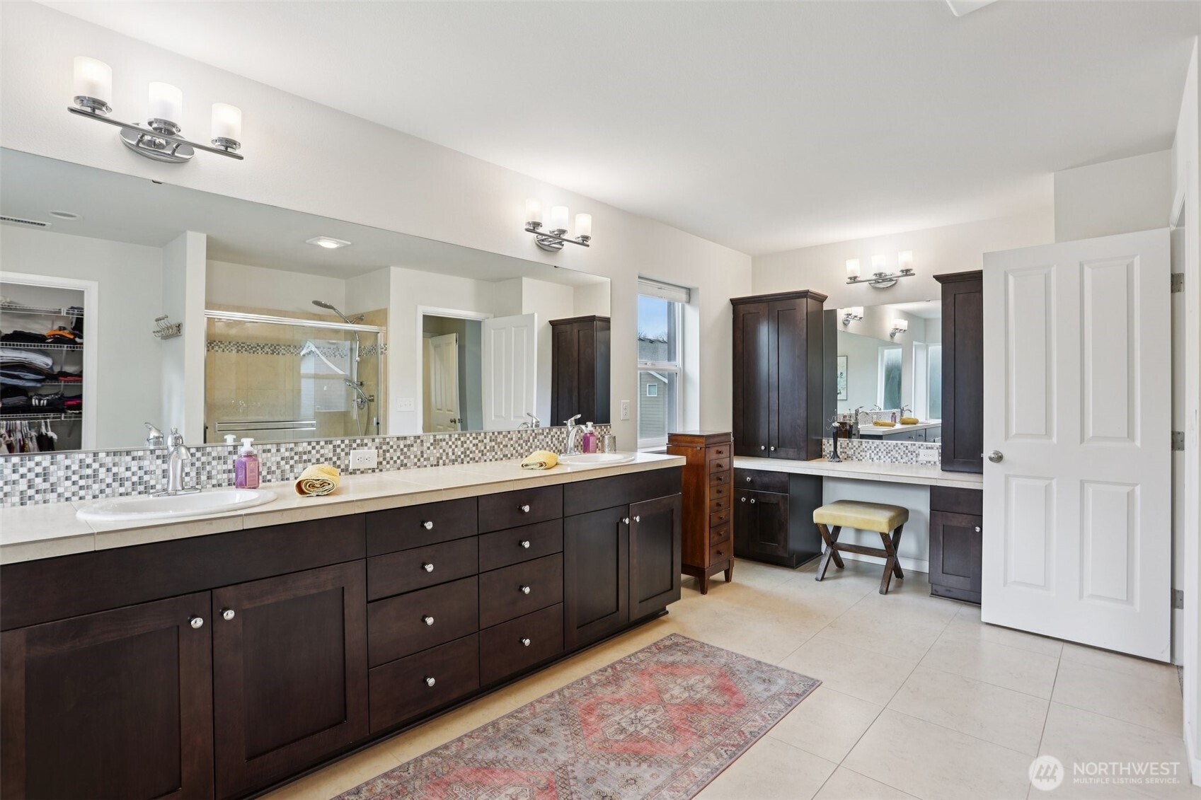 14025 163rd Place Southeast Renton, WA 98059 - Photo 14 of 33 a bathroom with a double vanity sink mirror and a bathtub