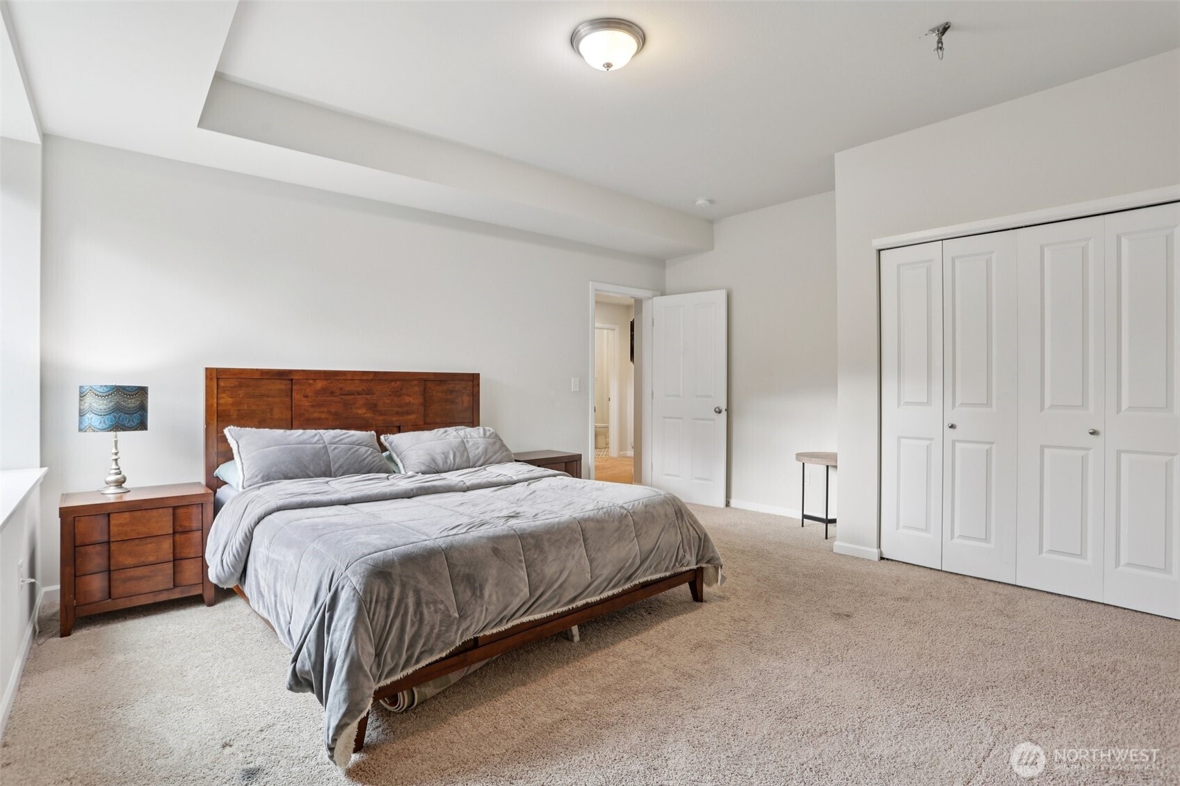 14025 163rd Place Southeast Renton, WA 98059 - Photo 24 of 33 a bedroom with a bed and a lamp