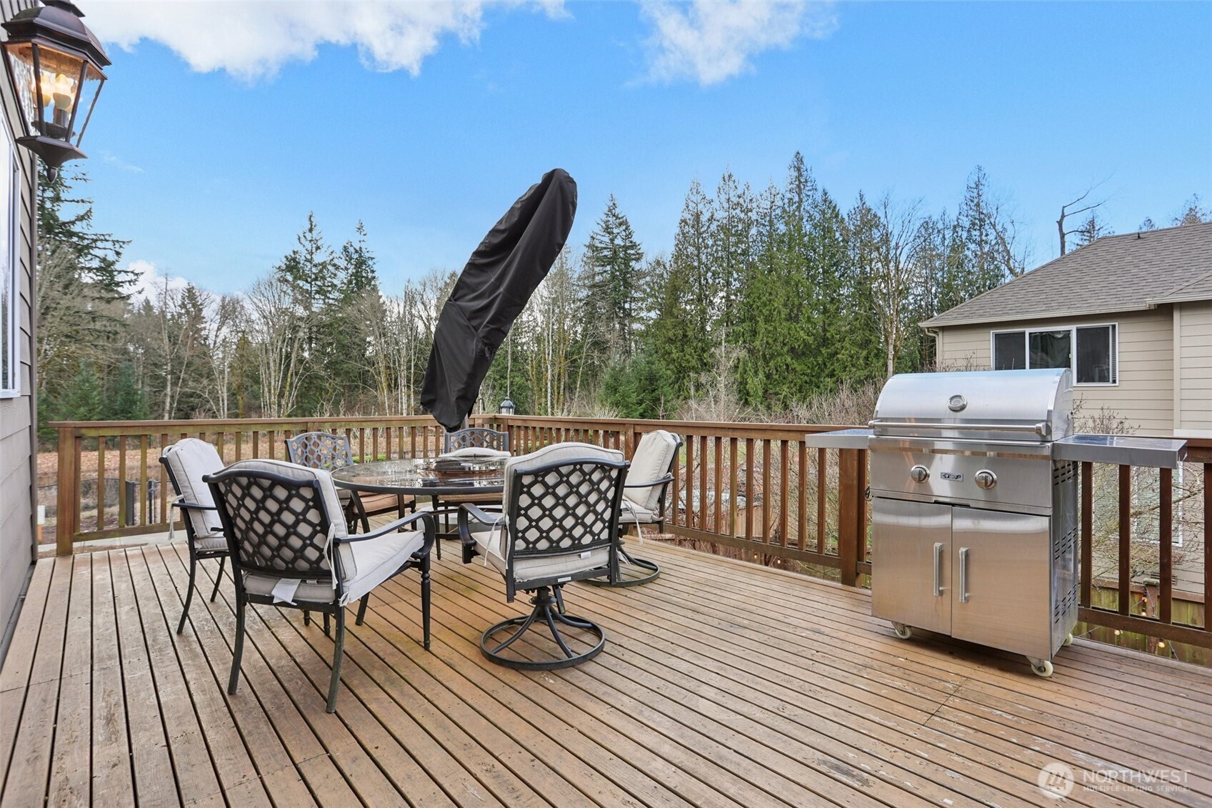 14025 163rd Place Southeast Renton, WA 98059 - Photo 29 of 33 a view of a roof deck with table and chairs and wooden floor