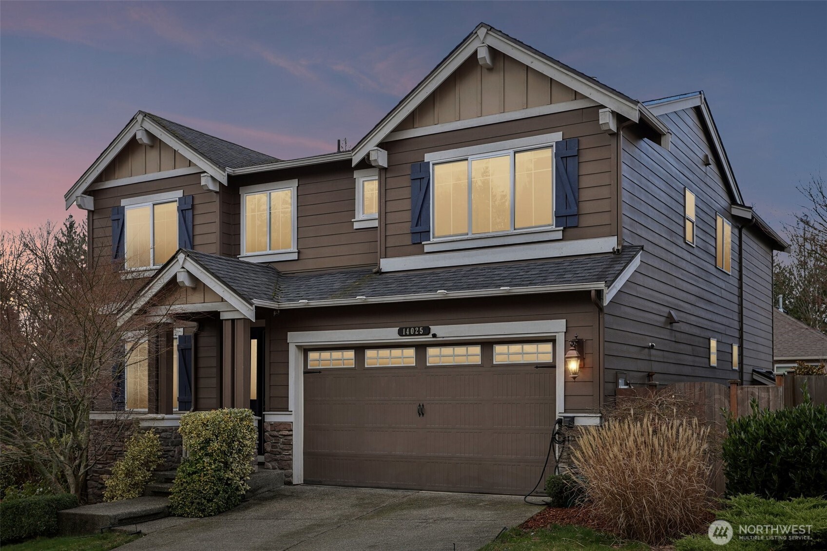 14025 163rd Place Southeast Renton, WA 98059 - Photo 33 of 33 a front view of a house with a yard and garage