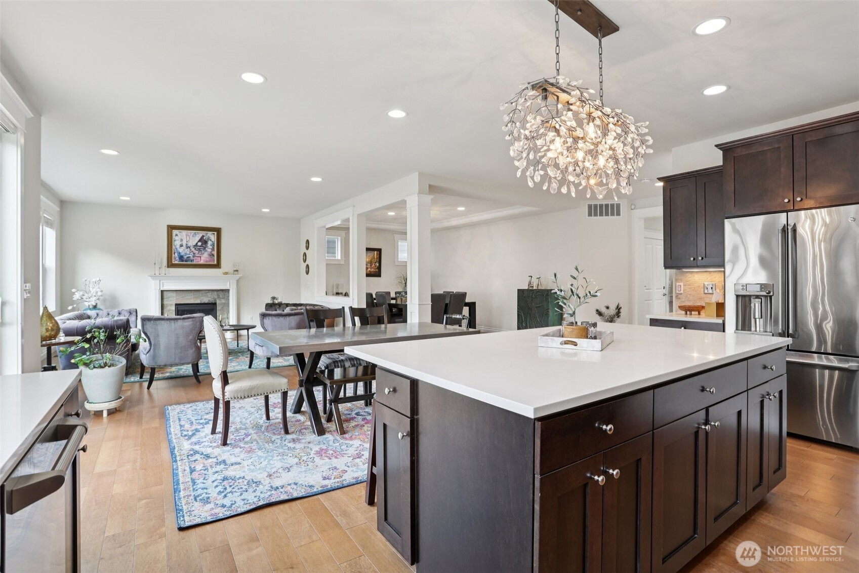 14025 163rd Place Southeast Renton, WA 98059 - Photo 7 of 33 a large kitchen with a table and chairs