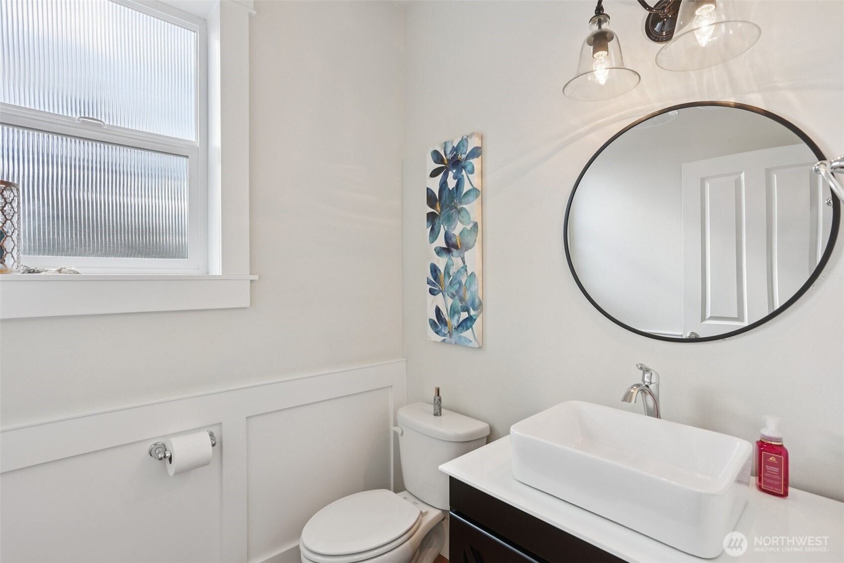 14025 163rd Place Southeast Renton, WA 98059 - Photo 10 of 33 a bathroom with a sink a toilet and a mirror