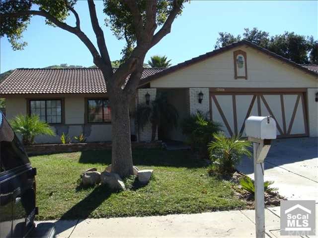 12008 Dressage Lane Riverside, CA 92503 - Photo 1 of 1 a front view of a house with garden