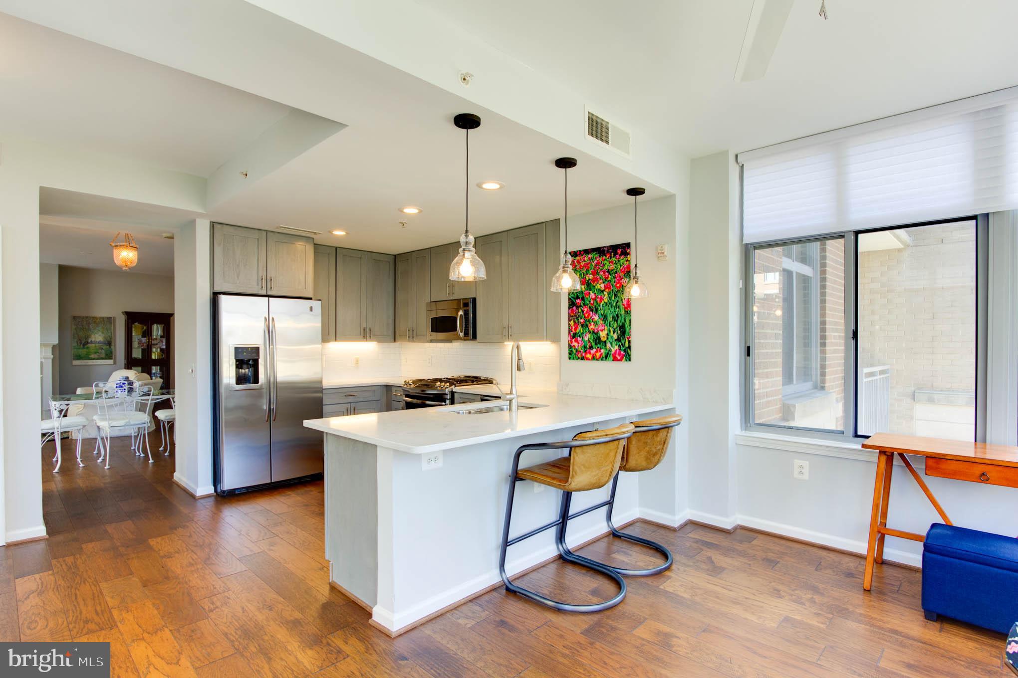 11990 Market Street, Unit 217 Reston, VA 20190 - Photo 24 of 82 Family Room to Kitchen